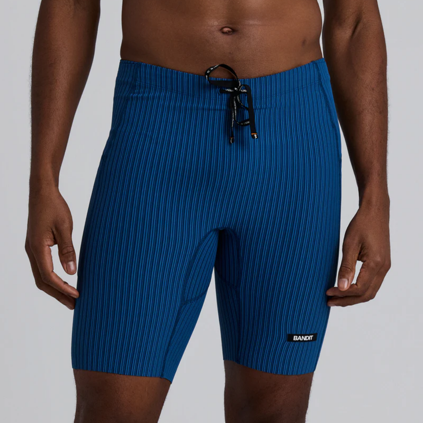 Bandit Running Striped Cadence™ 7 Pocket Lined Half Tights - Ink Blue/Aegean