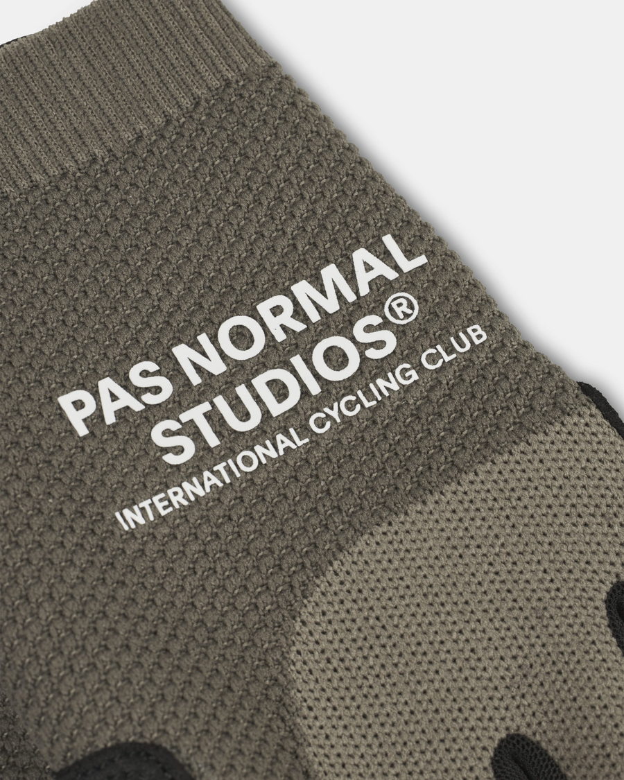 pas-normal-studios-escapism-gloves-earth-closeup